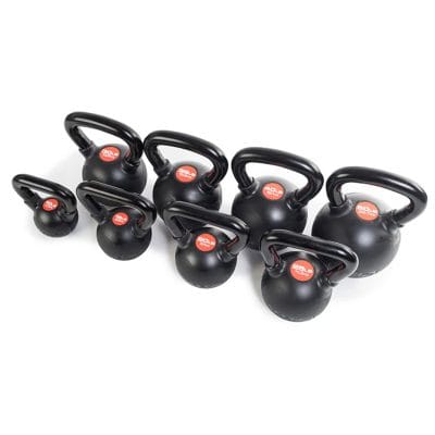 Group of CoreFX kettlebells displayed together by weight on gym floor