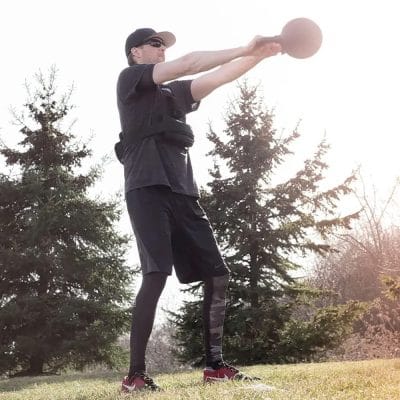 Athlete performing goblet squat with CoreFX kettlebell