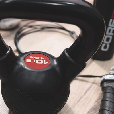 Angled view of CoreFX rubber coated kettlebells highlighting textured grip