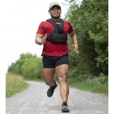 Person running while wearing CoreFX 20 lb weighted vest for added resistance