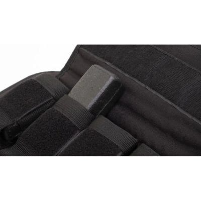 Close-up of CoreFX weighted vest showing removable weight bar partially inserted