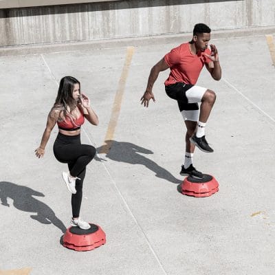 wo people performing cardio exercises using CoreFX step risers