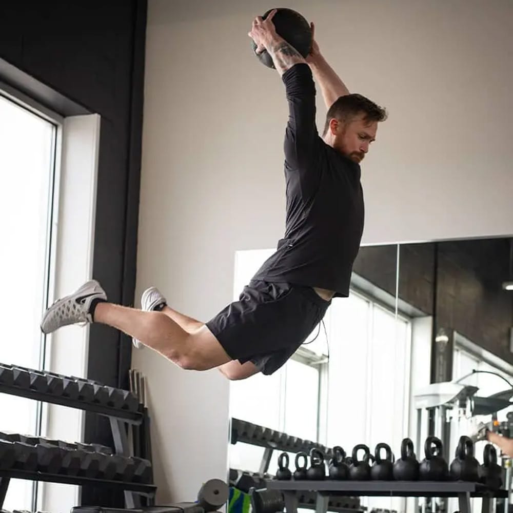 Athlete performing overhead slam with CoreFX slam ball