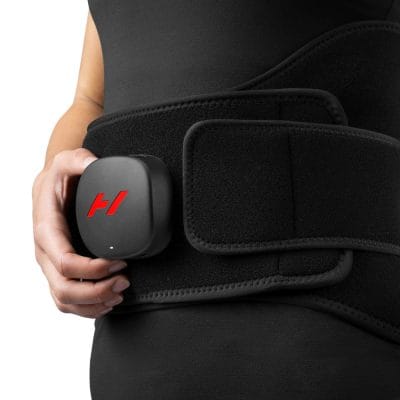 Person wearing the Hyperice Venom 2 Back for lower back heat therapy