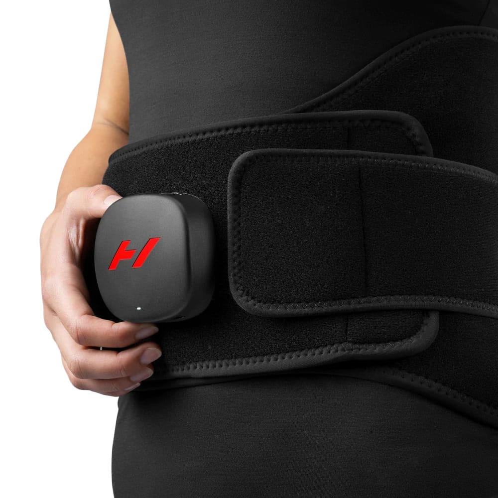 Person wearing the Hyperice Venom 2 Back for lower back heat therapy