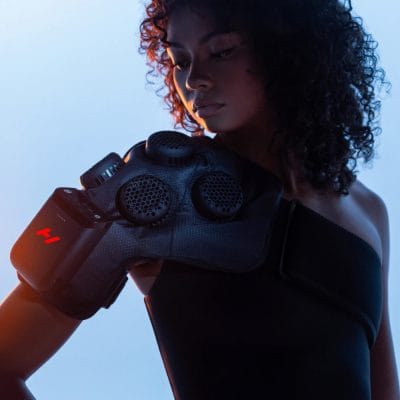 Hyperice X2 Shoulder wrap shown on shoulder for hot and cold therapy