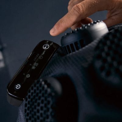 Close-up of the Hyperice X2 Shoulder therapy unit showing the ergonomic heating and cooling pad with premium detailing.