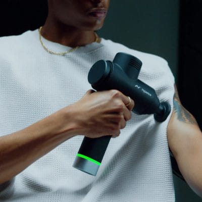 Hyperice Hypervolt 2 Pro applied to the biceps to ease muscle tension and support upper-arm recovery.