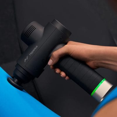 Hypervolt 2 Pro being used on the shoulder to reduce muscle stiffness and improve mobility.