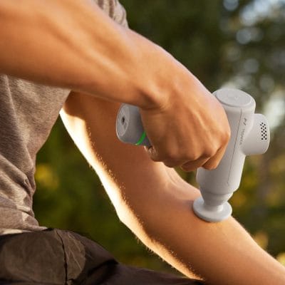 Person using the Hypervolt Go 2 on the forearm to relieve muscle tightness and support recovery.