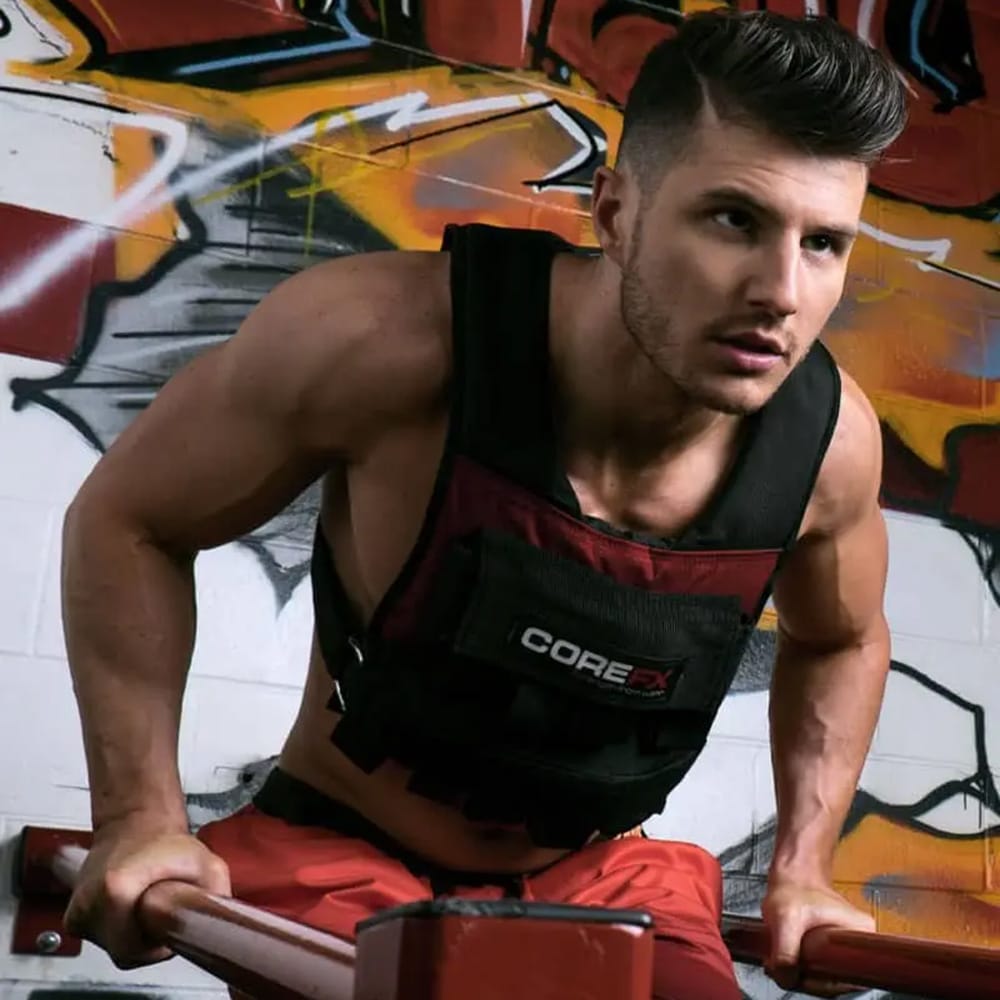 Athlete performing waist bar pull-ups while wearing CoreFX Pro weighted vest