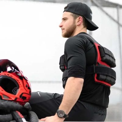 Athlete resting while wearing CoreFX Pro weighted vest between training sets