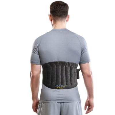 Recov Wrap microwavable moist heat pack applied to the lower back to reduce stiffness and muscle tension