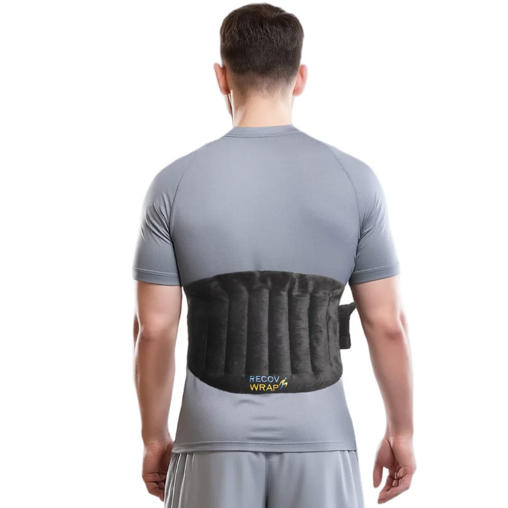 Recov Wrap microwavable moist heat pack applied to the lower back to reduce stiffness and muscle tension