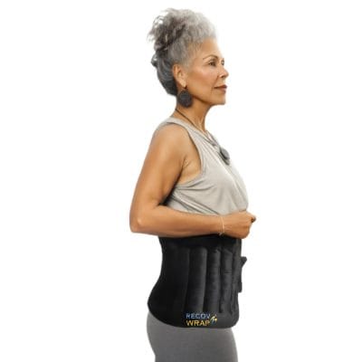 Recov Wrap applied to hips for warm therapy to reduce stiffness and soreness