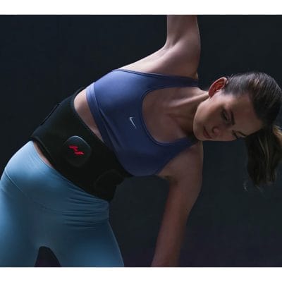 Athlete using the Hyperice Venom 2 Back for warm-up recovery