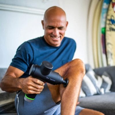 Person using the Hyperice Hypervolt 2 Pro to massage the calf muscle for tension relief and recovery.