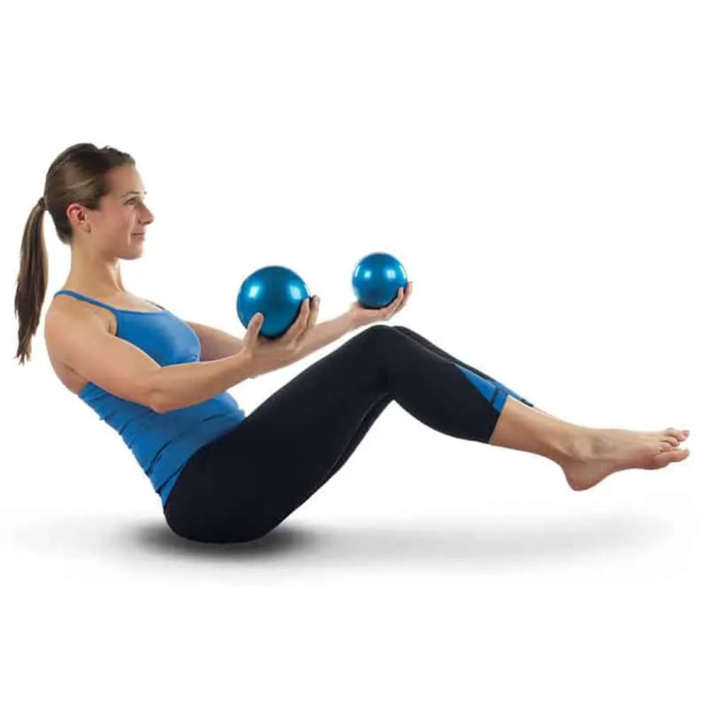 Women practicing yoga and balance training with two weighted yoga balls