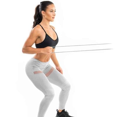 Female performing arm exercises using grey COREFX strength band