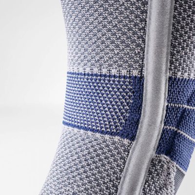 Close-up of the posterior knee area of the Bauerfeind GenuTrain P3 with grip top showing the side band and knit comfort zone