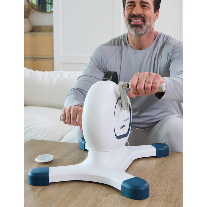 Seated user performing an arm exercise with the Nobol PhysioPedal