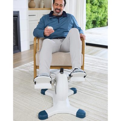 Senior exercising the lower body with the Nobol PhysioPedal