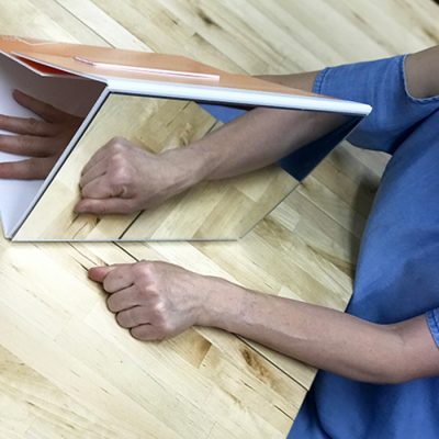 NOI Mirror Box used as part of a graded motor imagery rehabilitation program