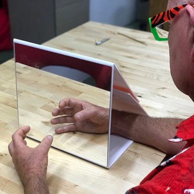 Close-up of NOI Mirror Box perspex mirror for rehabilitation use